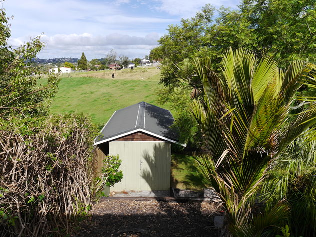 A view from one of the smaller outside decks over the back garden and farm.