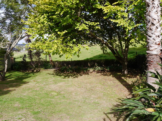 The bottom area of the garden. There is a hammock for sunny days.