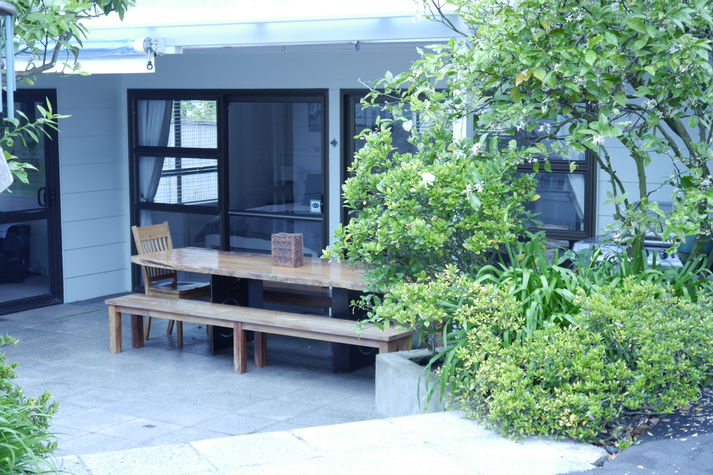 Citrus trees line the steps to your private, studio hideaway in Auckland City.