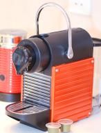 Nespresso machine and capsules are provided