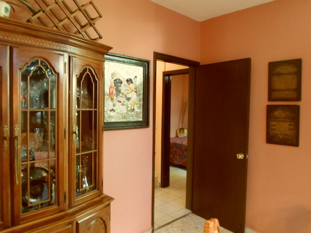 One bedroom off of DR downstairs