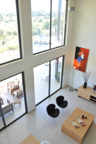 Double height sitting room with mezzanine