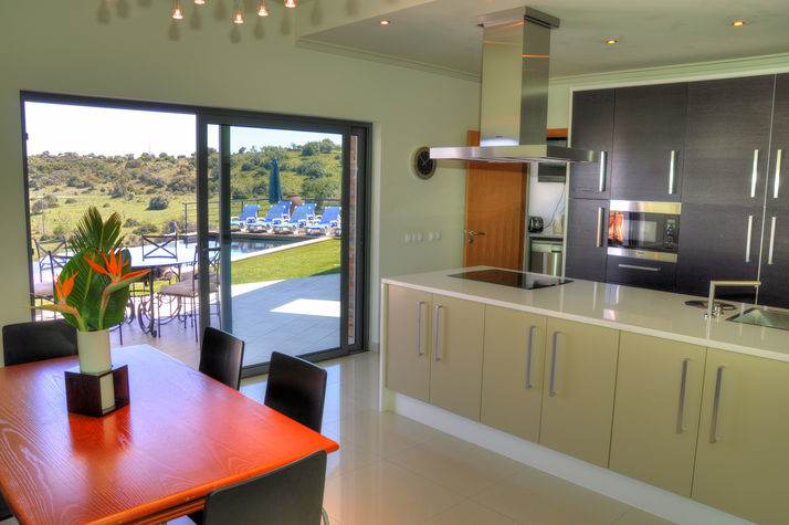 Kitchen and utility room 
Ultra modern kitchen equipped with Miele appliances including: fridge, freezer, microwave, oven and kitchen island with electrical hob and air extractor. 