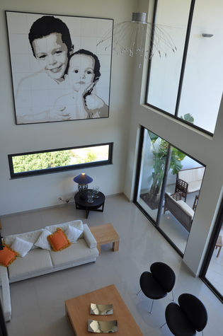 Double height sitting room with mezzanine
