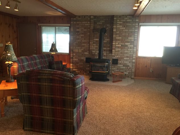 Large Living Area With An Authentic Rustic Design & Fireplace