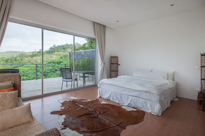 3rd Bedroom: Located on the ground floor and opens to pool area.