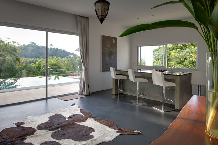 Bar with stools and easy access to pool.
