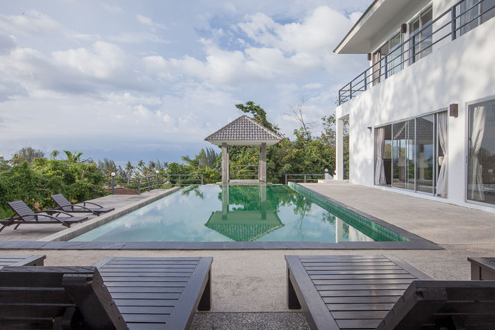 Pool view overlooks the beach and ocean in the distance. A 15 minute walk to the beach.