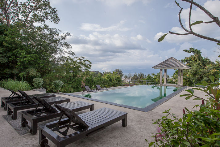 Infinity pool with a small Thai sala.