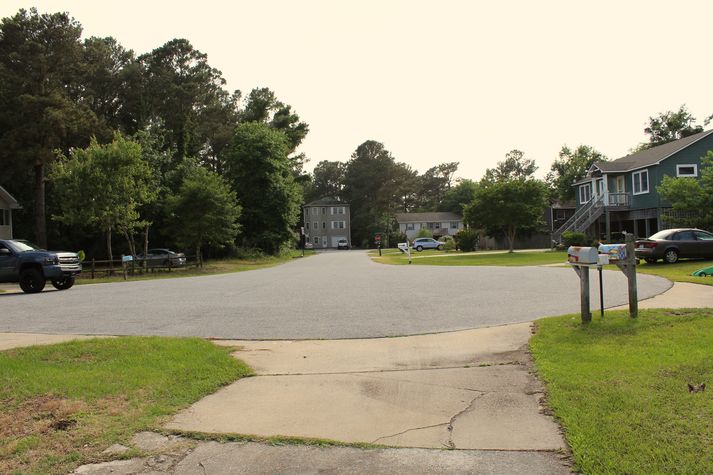 12- minute walk to the beach from the house....West facing view of Glider Ct. from driveway. Sunsets can be outstanding.