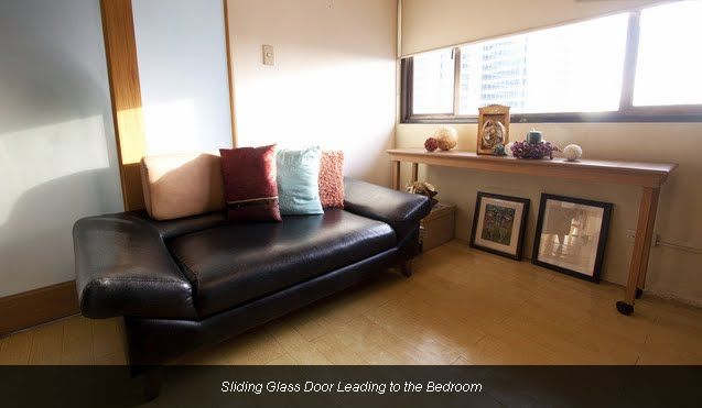 Sliding glass door leading to the bedroom