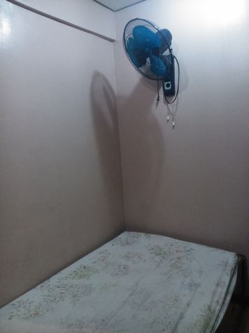 Another single bed in fan room