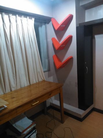 Window of master bedroom with built in shelvings and table