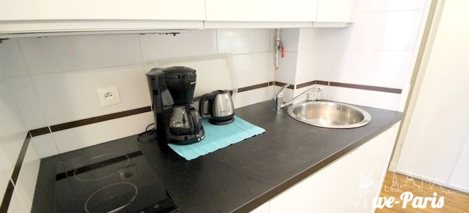 Paris Apartment Rental, Vacation in Paris
Sit down and relax after a long day of exploring Paris in this cozy Living Room / Kitchen. 