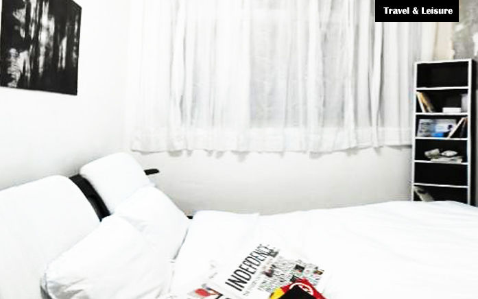 Bedroom A with original artwork on the wall