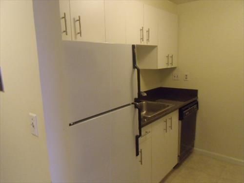 Fully equipped kitchen with full size appliances, pots, pans and dishes.