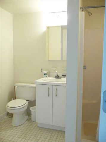 Large bathroom with shower/tub combination.