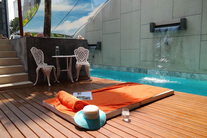 Sunbeds and mattress available at the pool area
