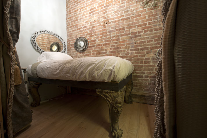 The Oak Room, formerly the Blue Room. Bed with Piano Legs from the 1800's. The height is for a single King or Queen.