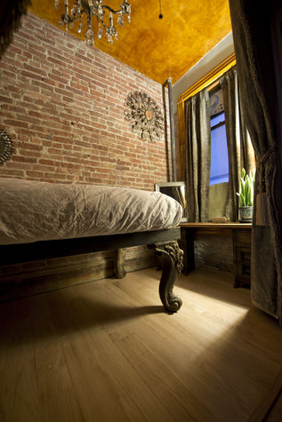 The Oak Room, formerly the Blue Room. Bed with Piano Legs from the 1800's. The height is for a single King or Queen.