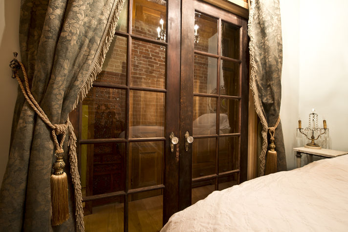 The Oak Room, formerly the Blue Room. Bed with Piano Legs from the 1800's. The height is for a single King or Queen.