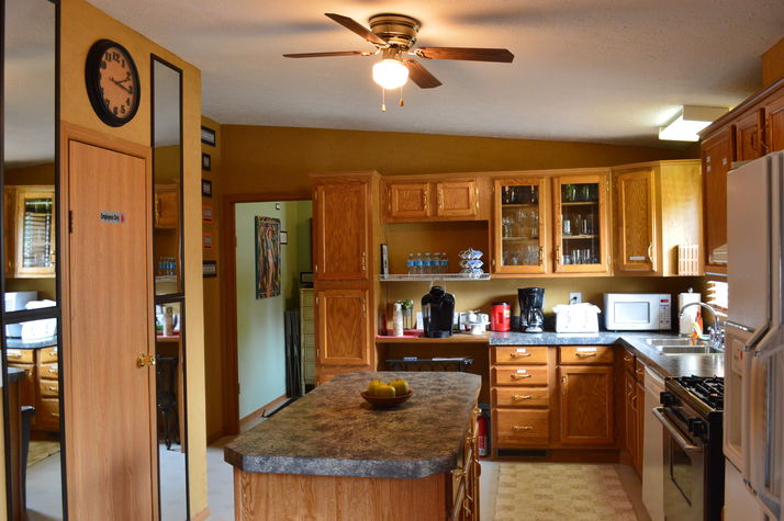 A roomy, fully-equipped kitchen for your convenience! Kitchen view facing foyer