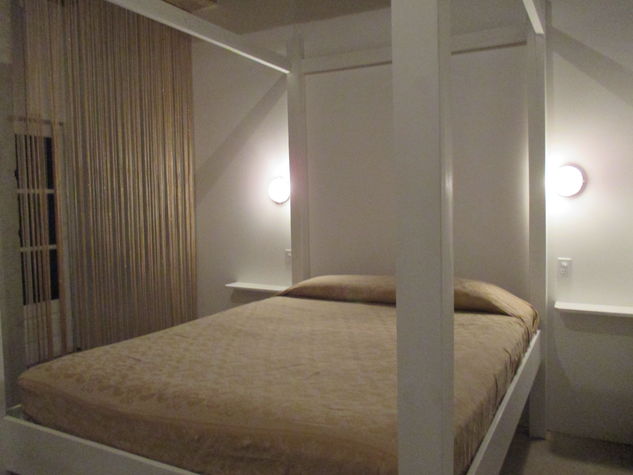 Four poster bed. Modern and interesting.