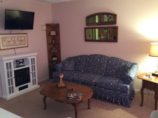 Flat screen TV with Cable television channels.