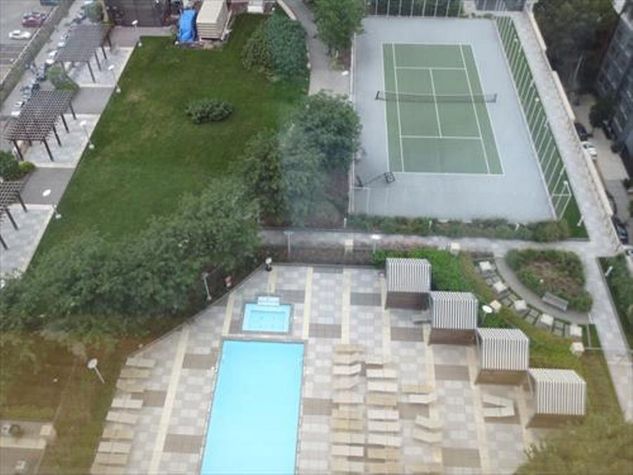 Swimming pool and tennis court on the rooftop deck