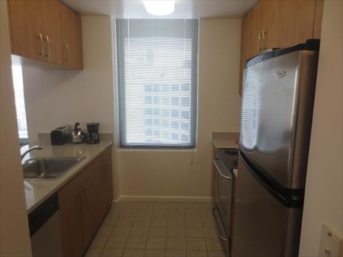 Fully equipped kitchen with convenient pass-through to the dining area