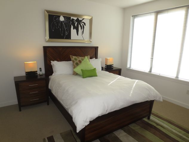 Master bedroom with en-suite bathroom, queen size bed and walk-in closet