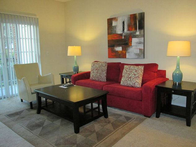 Comfortable living room with pullout sofa bed and club chair