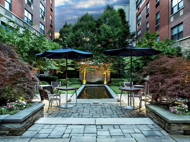 Have a relaxing moment at the botanical courtyard and landscaped pond