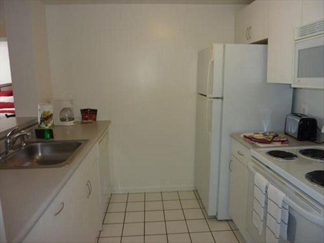 Fully equipped kitchen with full size appliances, pots, pans and dishes