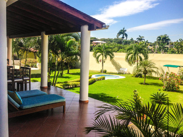 View of the backyard and jacuzzi from the terrace