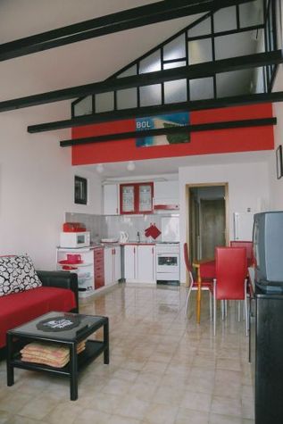 Living room with kitchen and dining area