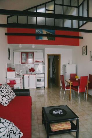 Living room with kitchen and dining area