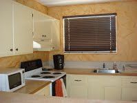 Kitchen has loads of cupboard space for your own groceries