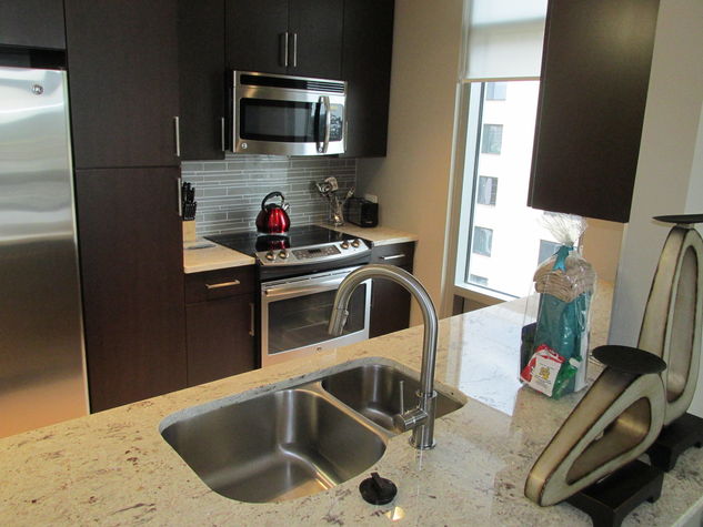 Fully-Equipped Kitchen with Stainless Steel Pots & Pans