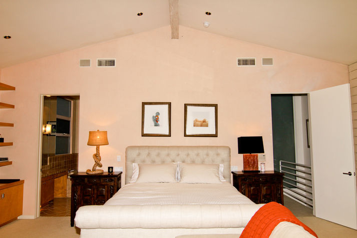The Master Marilyn Suite: CA King bed, his and her full bathrooms, fireplace, 55inch TV, entertainment system, seating area, work desk, private ocean-front terrace