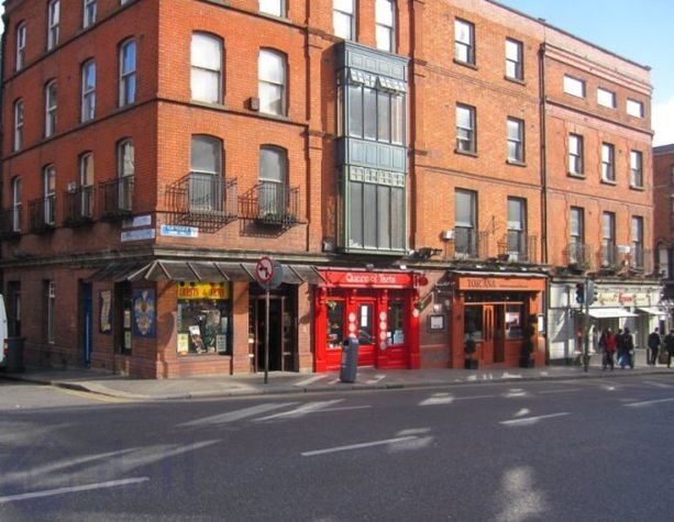 The apartment is on the top floor of an old Edwardian-era building at the top of Dame Street in Dublin's old historic centre... directly opposite Dublin Castle