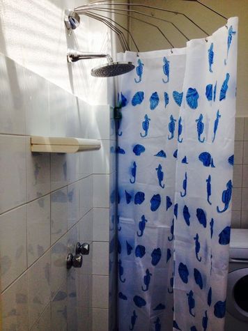 laundry with additional shower