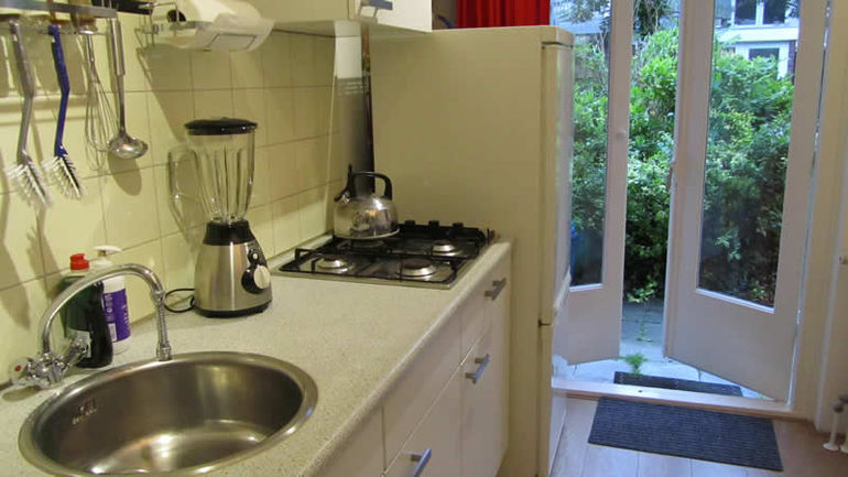 Kitchen leads on to garden via doors