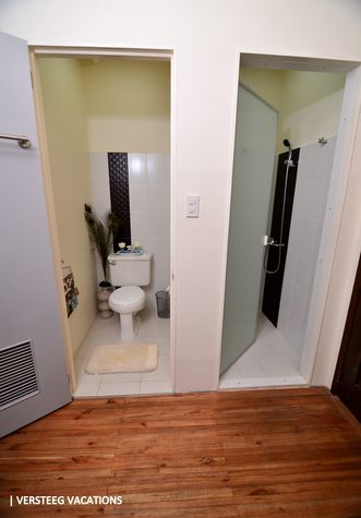 Toilet on the left, shower on the right. 