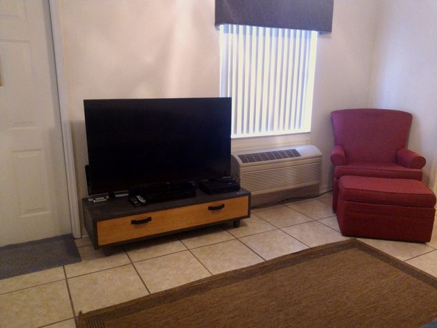 Large flat screen cable TV with storage & games