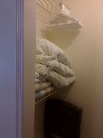 Walkin closet with extra linen, storage and cooler