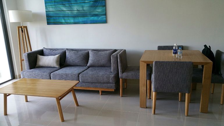 Relax in style in the comfortable living area that connects with the greenery outside.