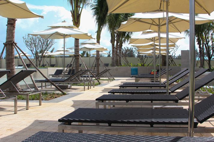 Sun loungers by the pool in front of our apartment.