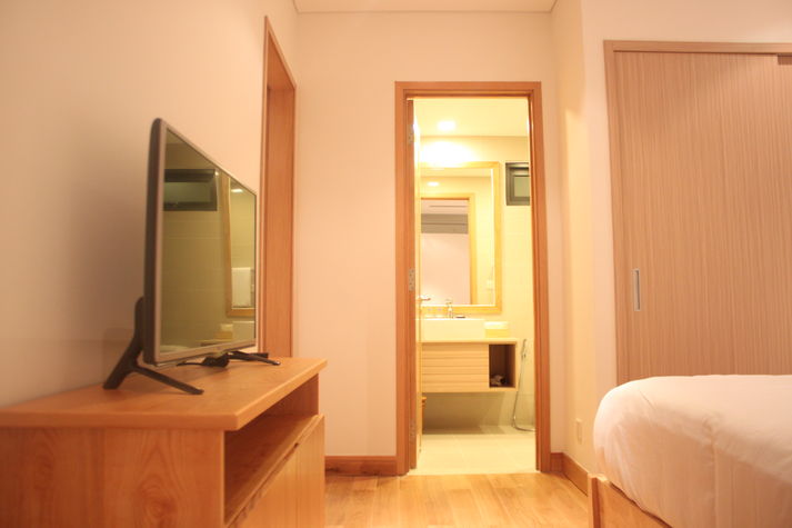 The bedroom with a 32" LCD, a huge wardrobe and an en-suite bathroom with shower.