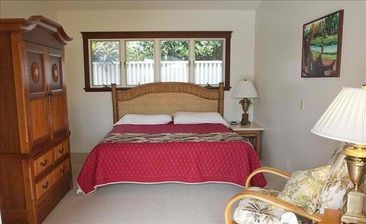 Villa Bedroom, next to outdoor kitchen, French doors open to pool